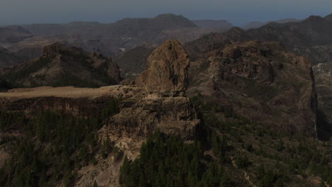 roque nublo, gran canaria: wonderful aerial shot with crane movement, at close range and during sunset of roque nublo on the island of gran canaria