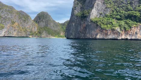 Maya-bay-beach-on-background-surrounded-by-cliffs,-Thailand,-travel-destination