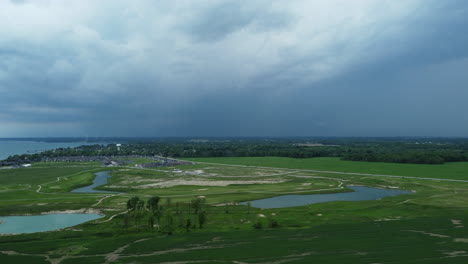 Aerial-View-Of-Golf-Course-And-Highway-With-Overcast-In-Port-Dover,-Ontario,-Canada