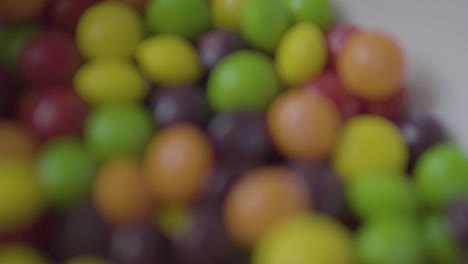 Close-up-of-candy-being-poured-into-bowl