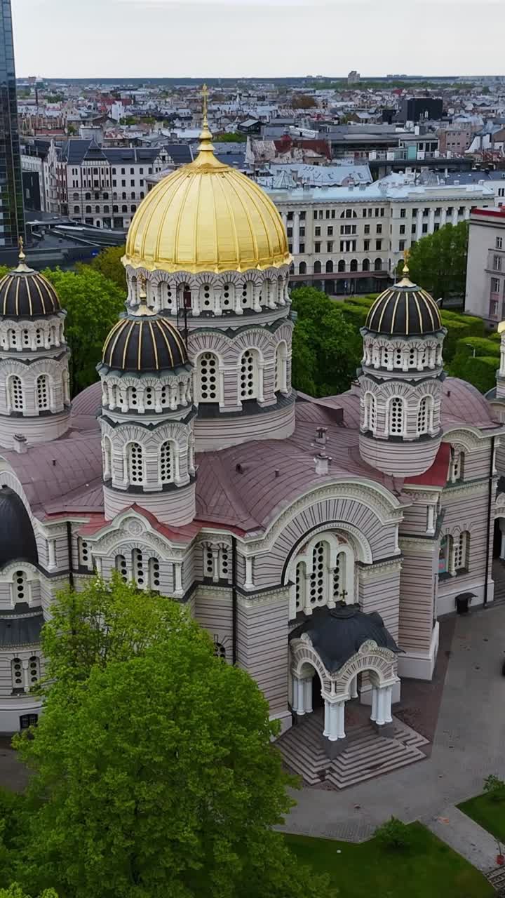The Nativity of Christ Cathedral, With its Gleaming Golden Dome, Stands Tall in Central Riga, Latvia - Vertical Shot