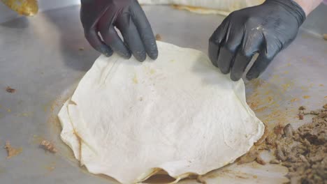 preparing shawarma or pita