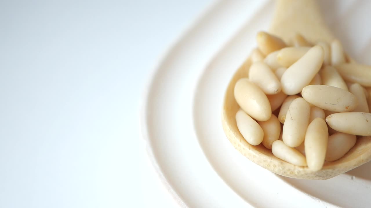 Pine Nuts in Wooden Spoons