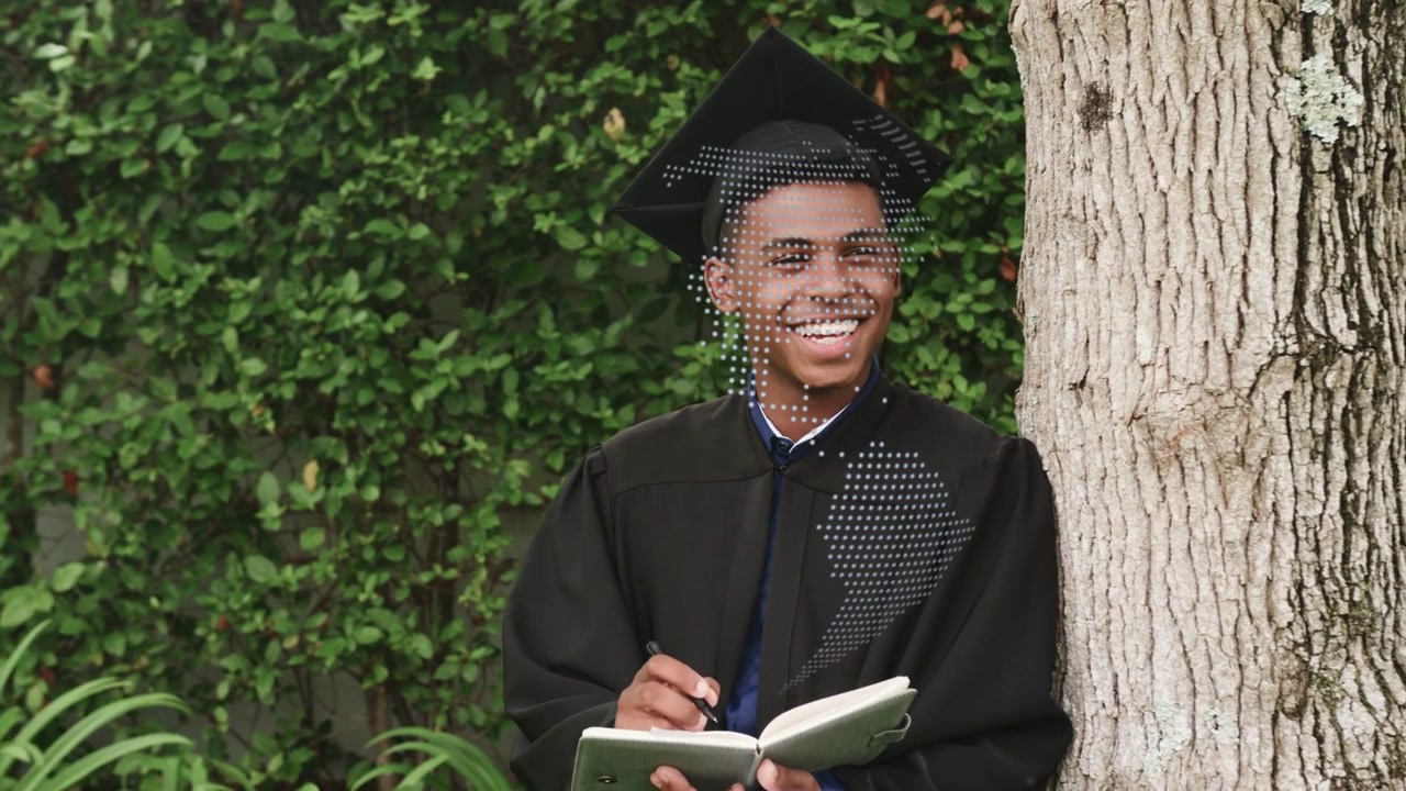 Grad entering frame, stopping at tree writing book as dotted globe over torso, reflecting education