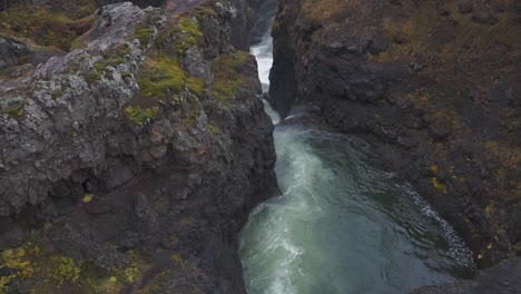 cascading river stream in the kolugljufur waterfall canyon in iceland