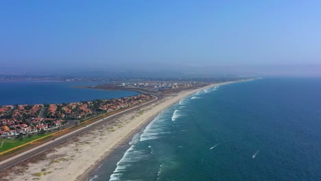 Side-panning-shot-of-highway-75-which-is-called-Silver-Strand-blvd-on-Coronado-beach-in-San-Diego-California