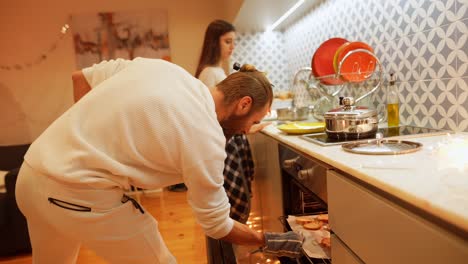 couple baking bread in the kitchen