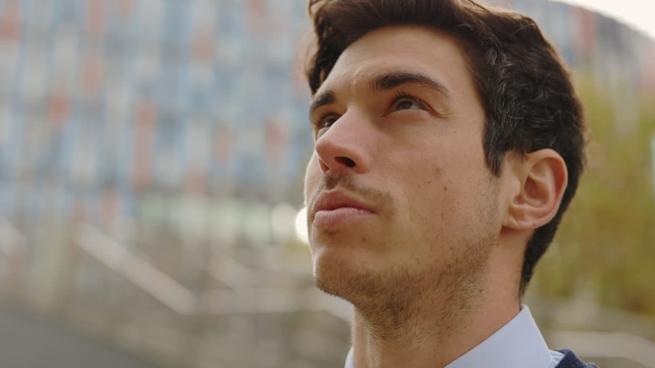 Portrait of a Man Looking Upwards in an Urban Setting