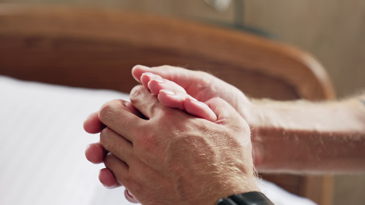 Male hands holding female hand. Man supporting and soothing his wife. Close up.