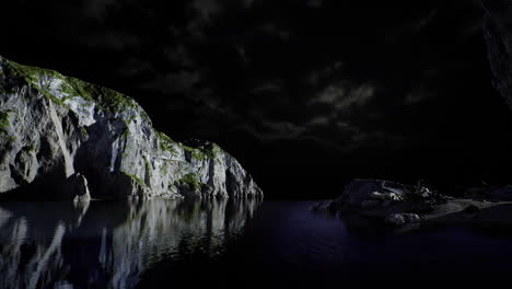 a tranquil coastline is set against a dark cloudy sky