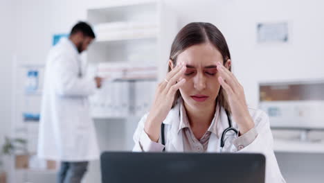 Laptop,-healthcare-and-headache-with-a-doctor