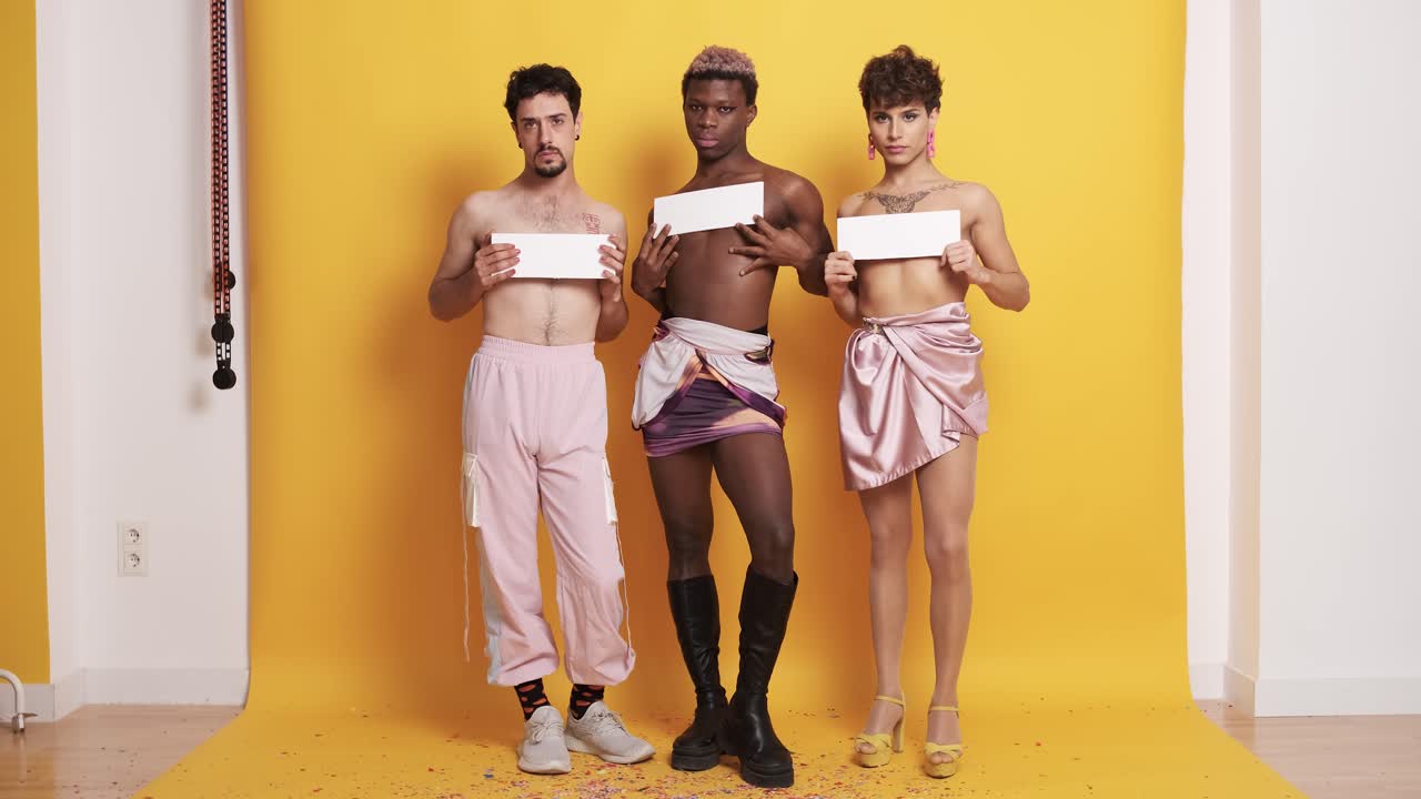 Trans men covering their breasts with white panels