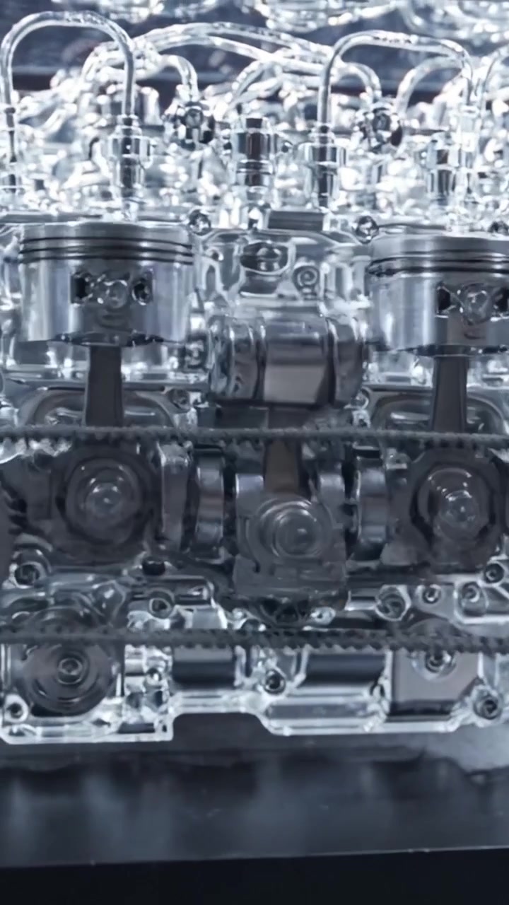 Detailed View of a Transparent Internal Combustion Engine Model Showcasing Complex Mechanisms and Precision Engineering in Modern Automobile Design