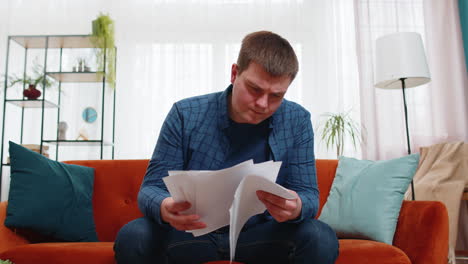 Stressed-angry-man-freelancer-reviewing-failure-mistake-charts-and-graphs-and-throwing-papers-in-air