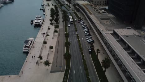 Drone-revealing-shot-of-the-port-of-Split,-Croatia,-Adriatic-Sea-with-parked-boats,-yachts-and-vessels