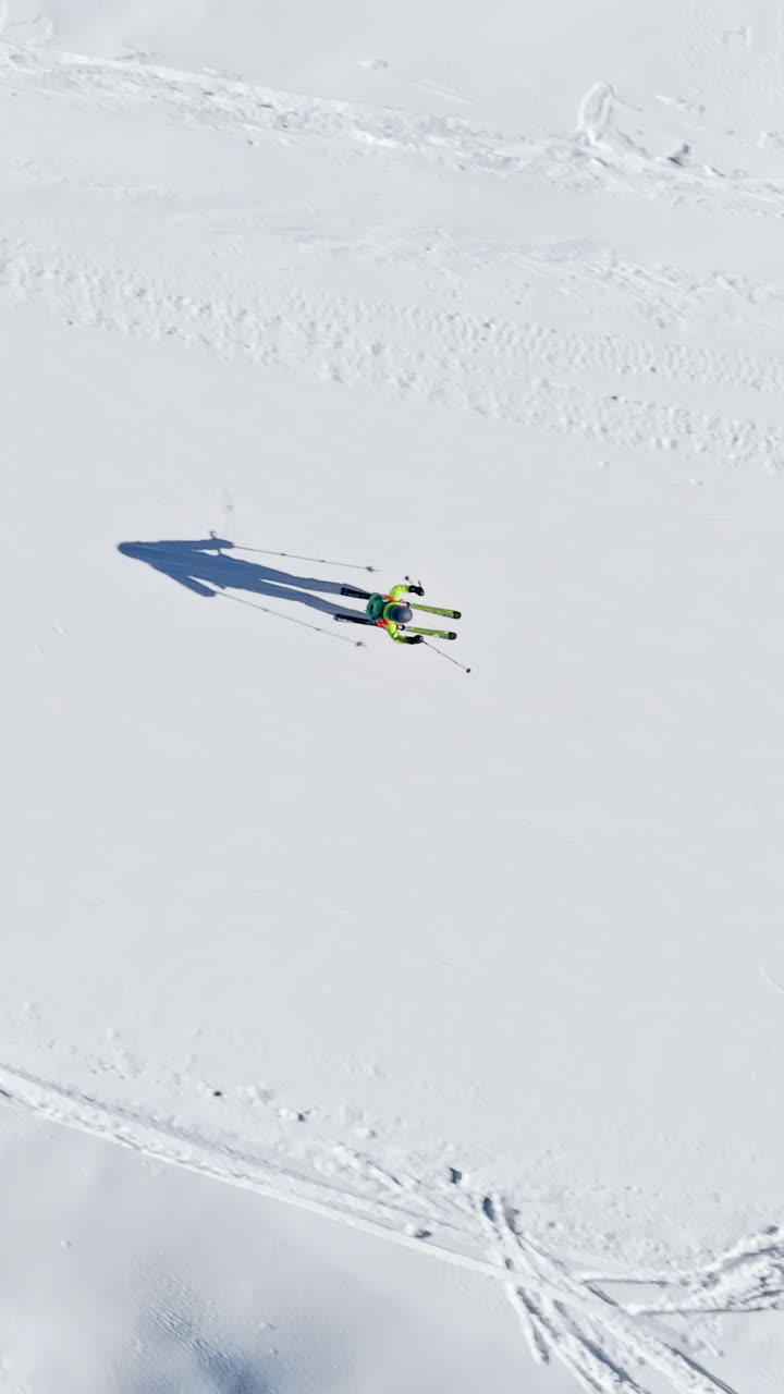 Aerial drone view of a ski resort in Col dei Baldi, Alleghe, in the Dolomites, Italy in daylight. Vertical