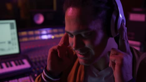 male sound engineer working at a mixing desk