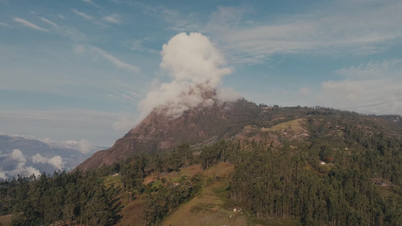 Clouds Covered The Mountain Peak In Daytime In Peru. - aerial shot