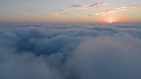 aerial view above the clouds at the sunset