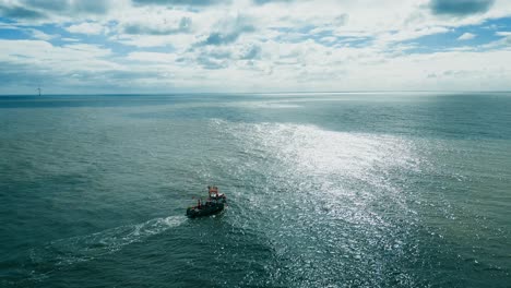 fishing trawler boat ship sailing into the midday