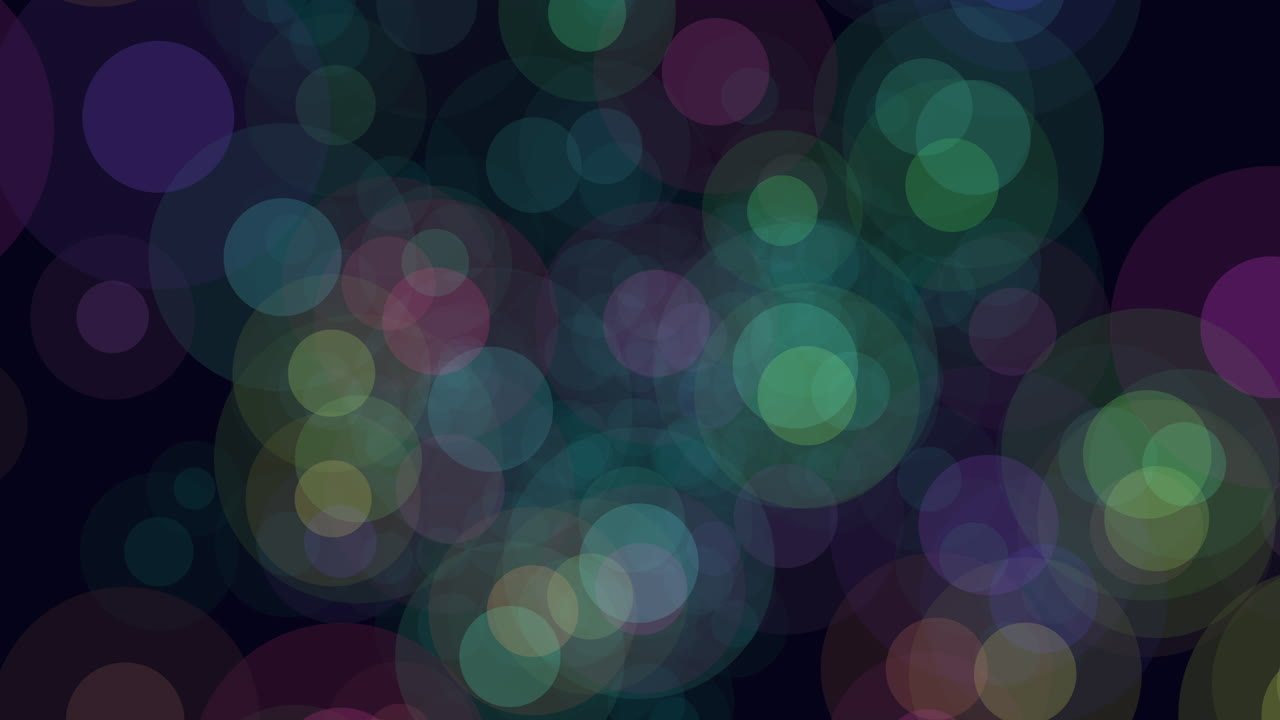 Colorful circles arranged in a dynamic pattern seem to be in motion on a dark background, creating a vibrant and abstract visual experience