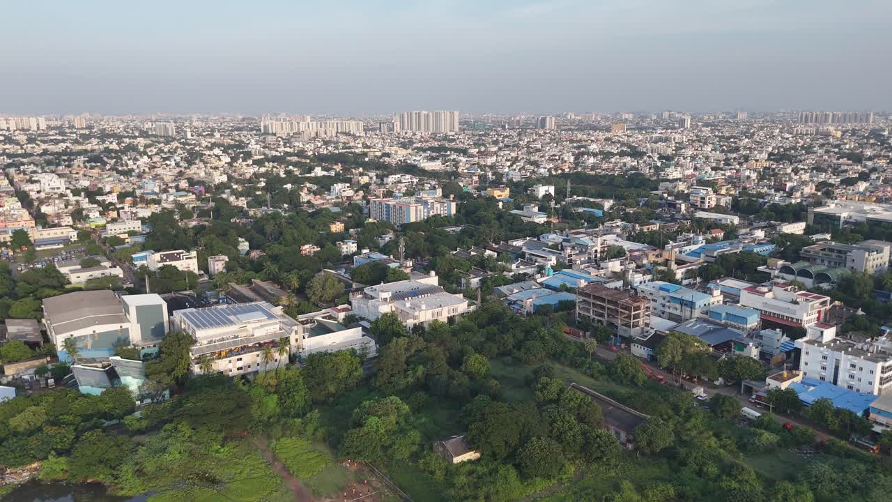 Wide shot of metropolitan skyline under soft morning light