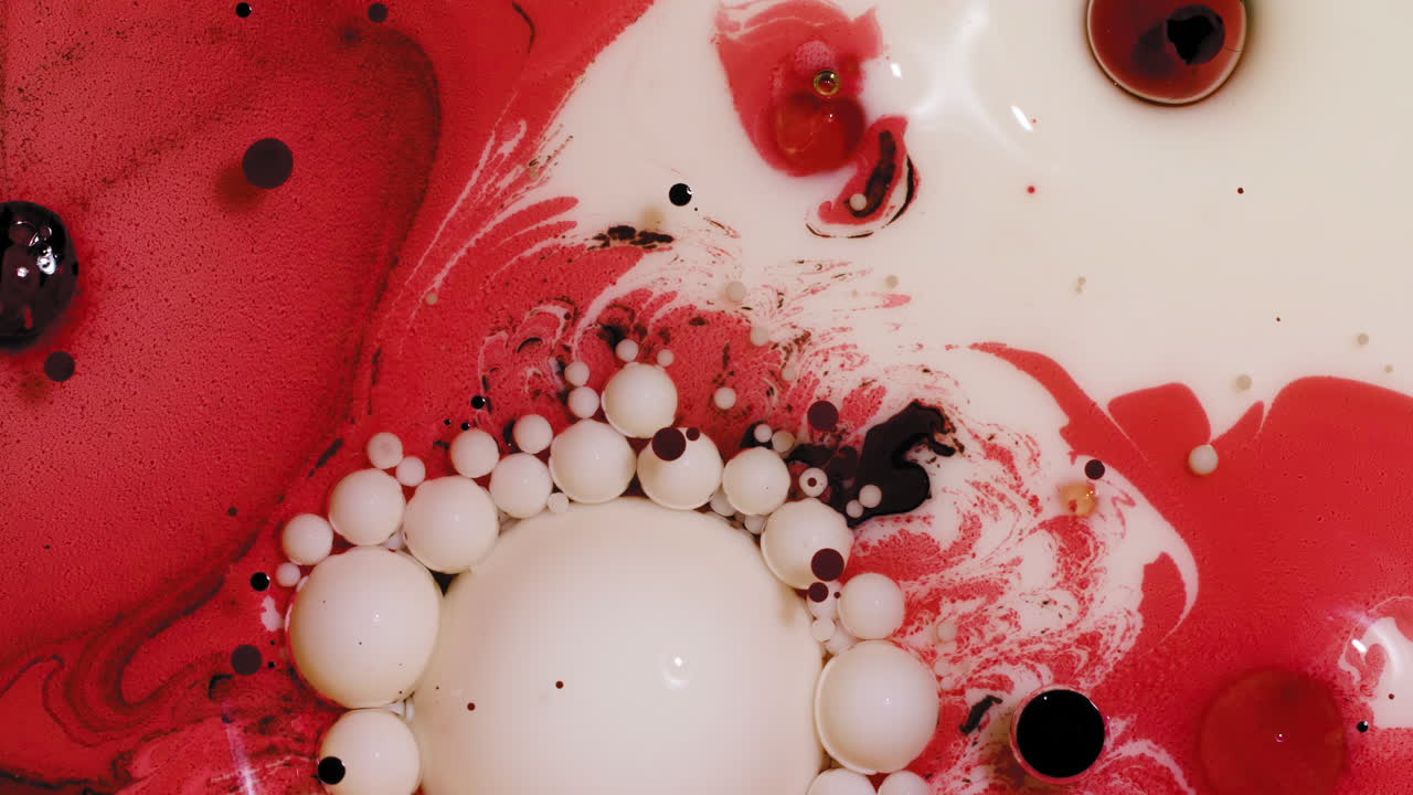 Red and cream colored acrylic paint mix, abstract fluid art background with Valentine's Day color scheme