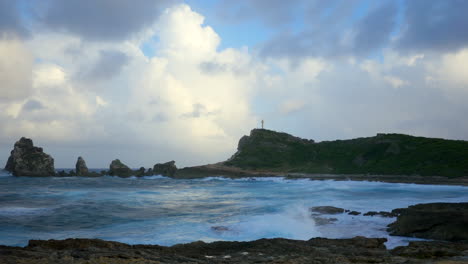 Timelapse-of-big-waves-hitting-the-rocky-coastline-in-the-evening-during-golden-hour