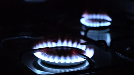 close up of two gas burners, focusing from one to another