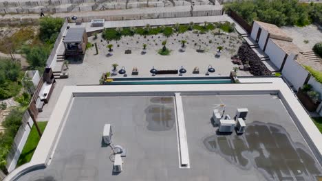 Aerial-tilting-shot-showing-the-seafront-villa-with-a-private-pool-in-Frontignan