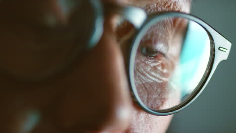 Macro-of-senior-eyes-with-reflection-of-internet