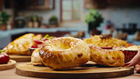 baked bread displayed on a wooden board in a kitchen