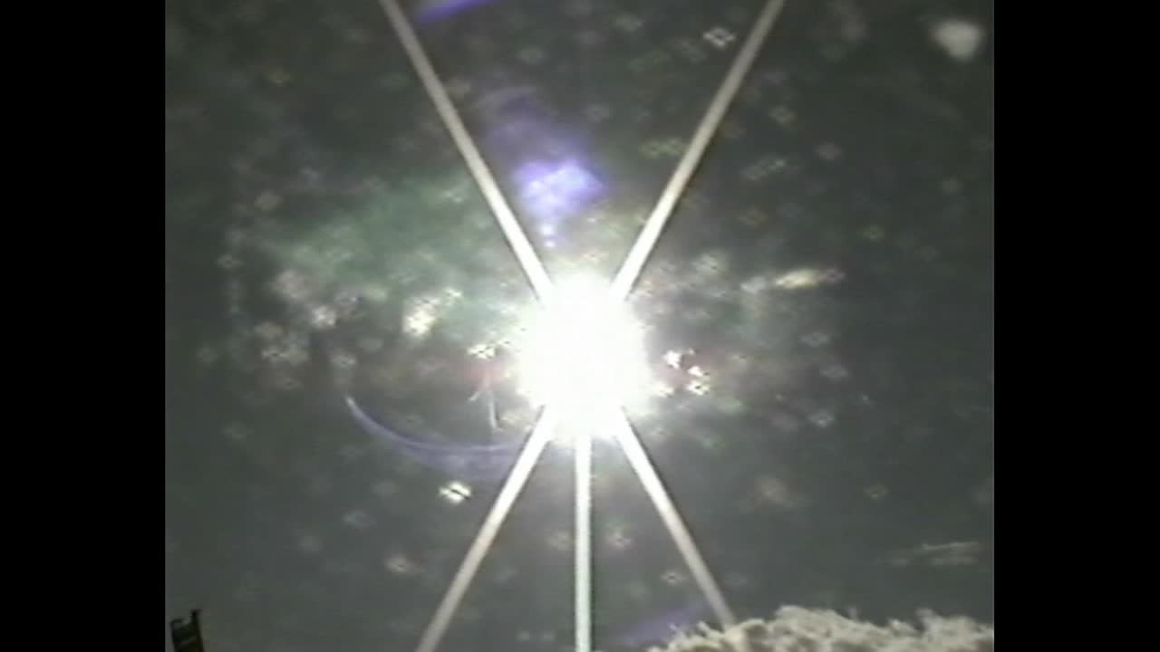 City silhouette with strong sunbeam and lens artifacts