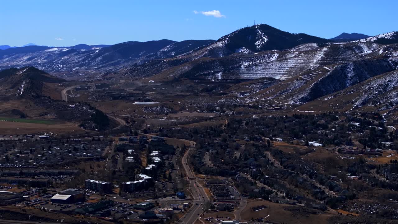 Winter morning downtown Morrison Golden Colorado aerial drone Red Rocks Denver Suburbs neighborhood city front range Lookout North Table Mountain sunny blue sky snow on hills static shot