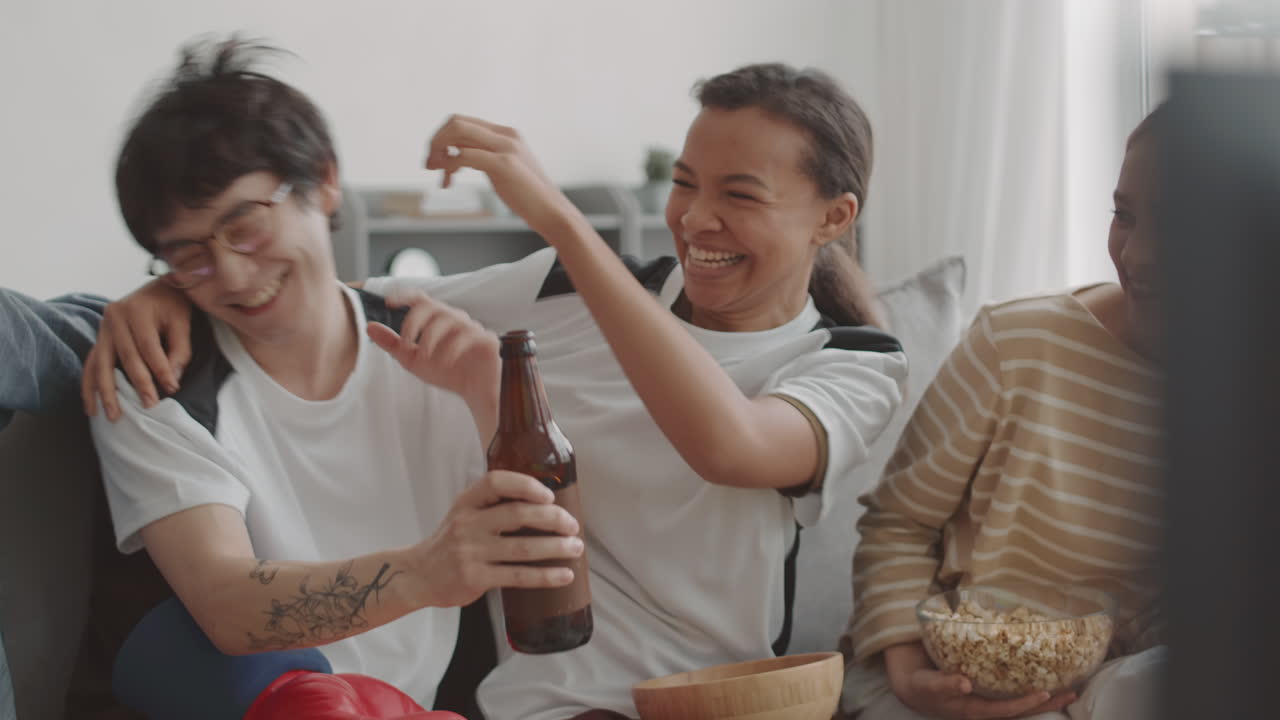 Friends Having Fun Watching TV