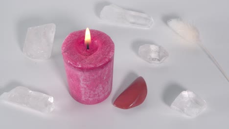 root chakra candle with red jasper and clear quartz