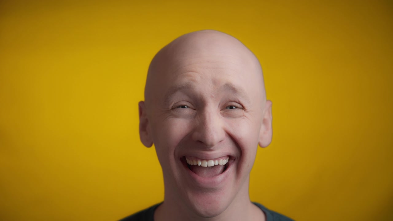 Man laughing towards the camera
