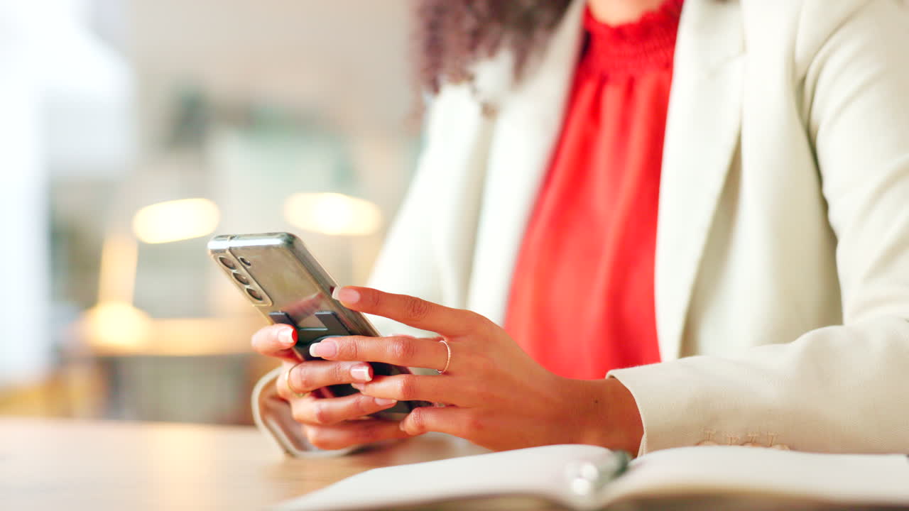 Closeup of a business woman texting on a phone