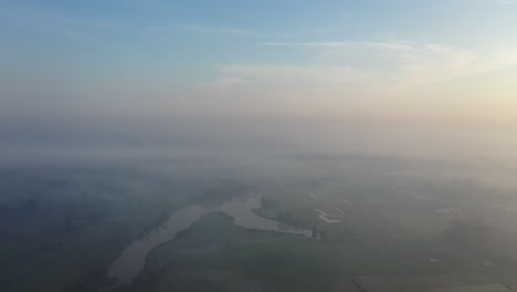 misty sunrise aerial view of rural landscape