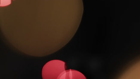video of flickering multi coloured bokeh spots of light with copy space