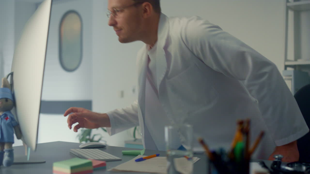 Doctor have videoconference using computer in modern clinic. Consulting online.