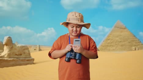 child exploring egypt's pyramids with a smartphone