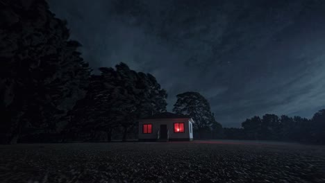 small, isolated house stands in a field at night, its windows glowing with an eerie red light as trees sway in the wind under a dark, stormy sky
