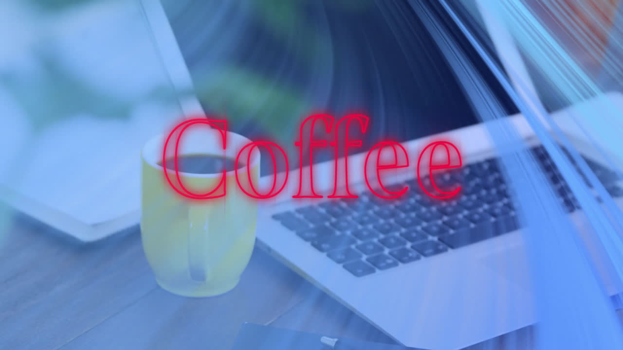 Yellow ceramic coffee mug steaming beside open silver laptop keyboard, showing red Coffee overlay