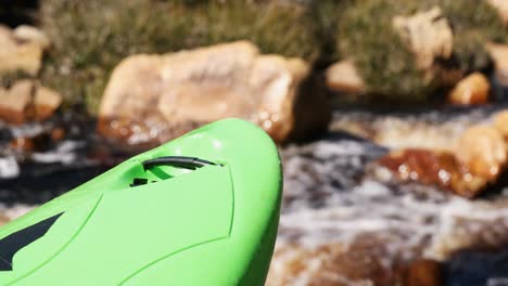 green kayak against the flowing river 4k