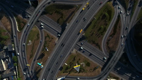 drone view cars driving on freeway overpass. aerial view car traffic on highway