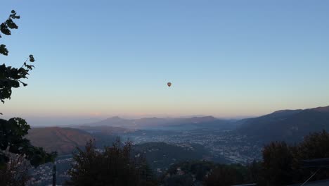 hot air balloon over the alps in como, italy