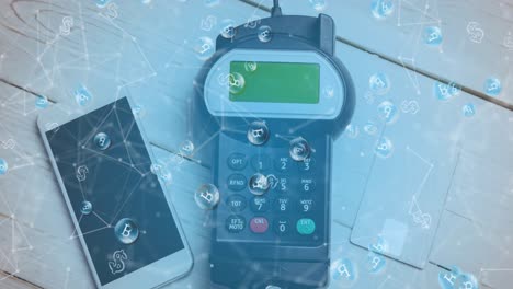 Animation of bitcoins over smartphone and payment terminal