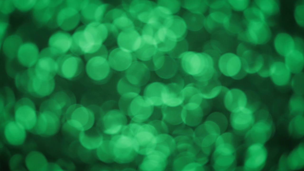 Sfondo bokeh astratto di glitter verde scintillante