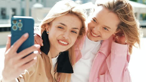 two happy friends taking a selfie